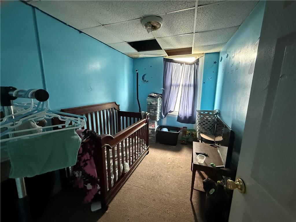 117 Charles Street Pittsburgh, PA 15210 - Photo 10 of 17 a room with furniture and a window