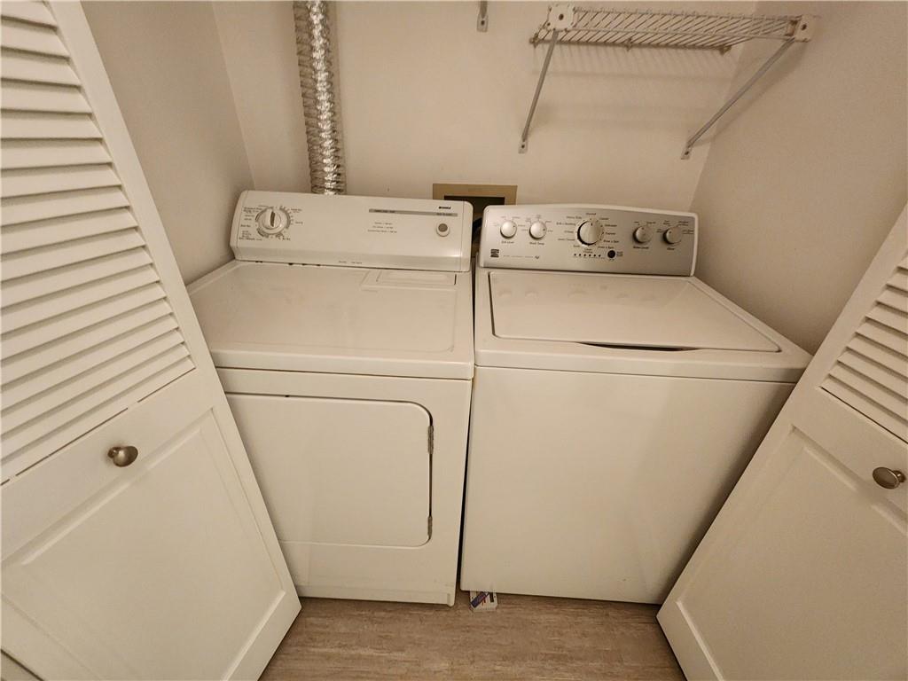 199 14th Street Northeast, Unit 209 Atlanta, GA 30309 - Photo 12 of 13 a utility room with dryer and washer