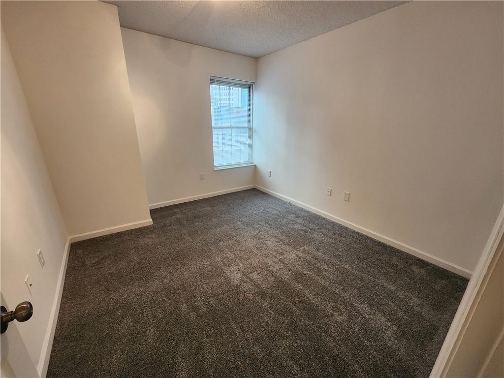 199 14th Street Northeast, Unit 209 Atlanta, GA 30309 - Photo 7 of 13 an empty room with windows