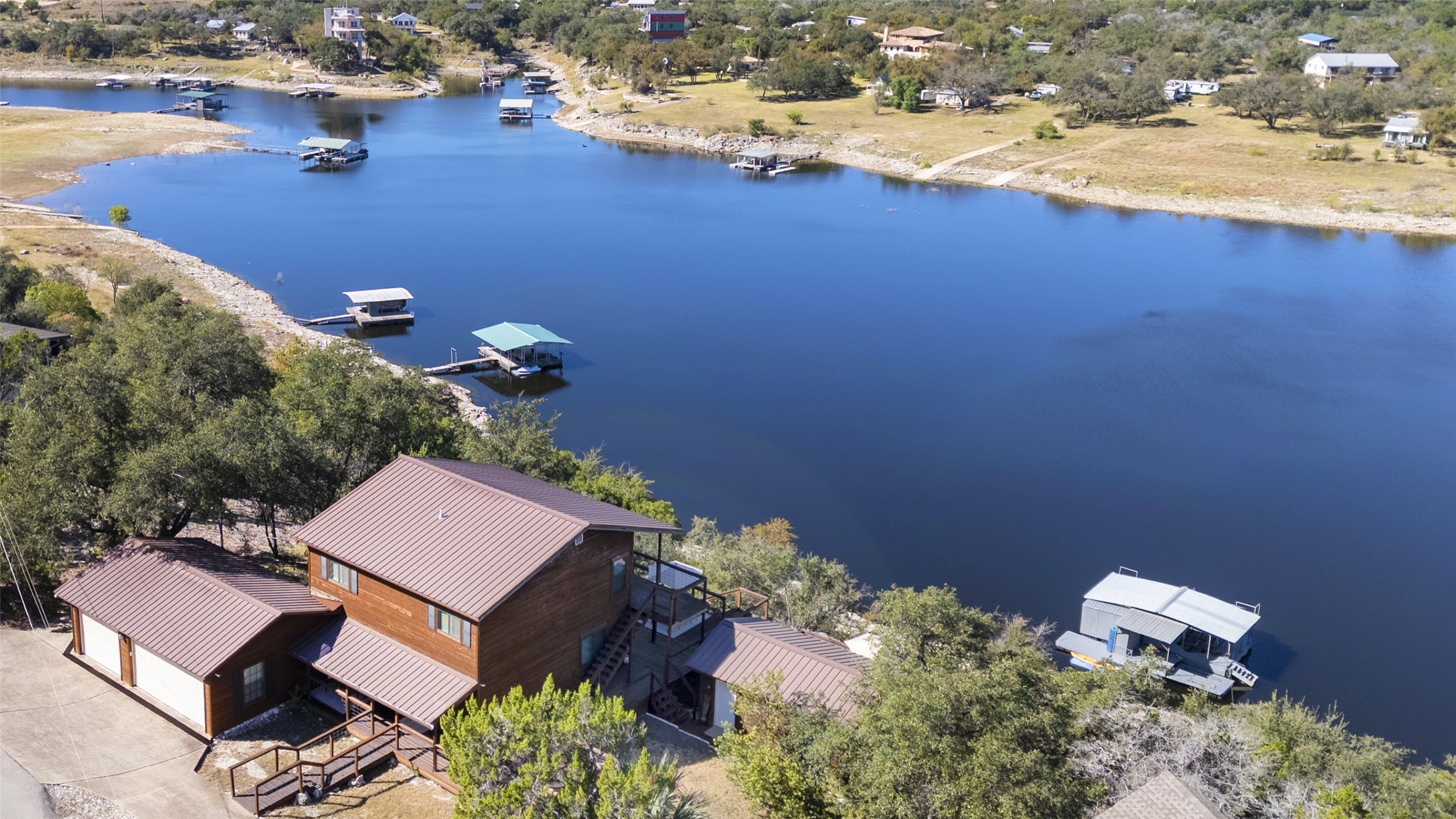 19645 Lakehurst Loop Spicewood, TX 78669 - Photo 40 of 40 Drone / aerial view of waterfront land