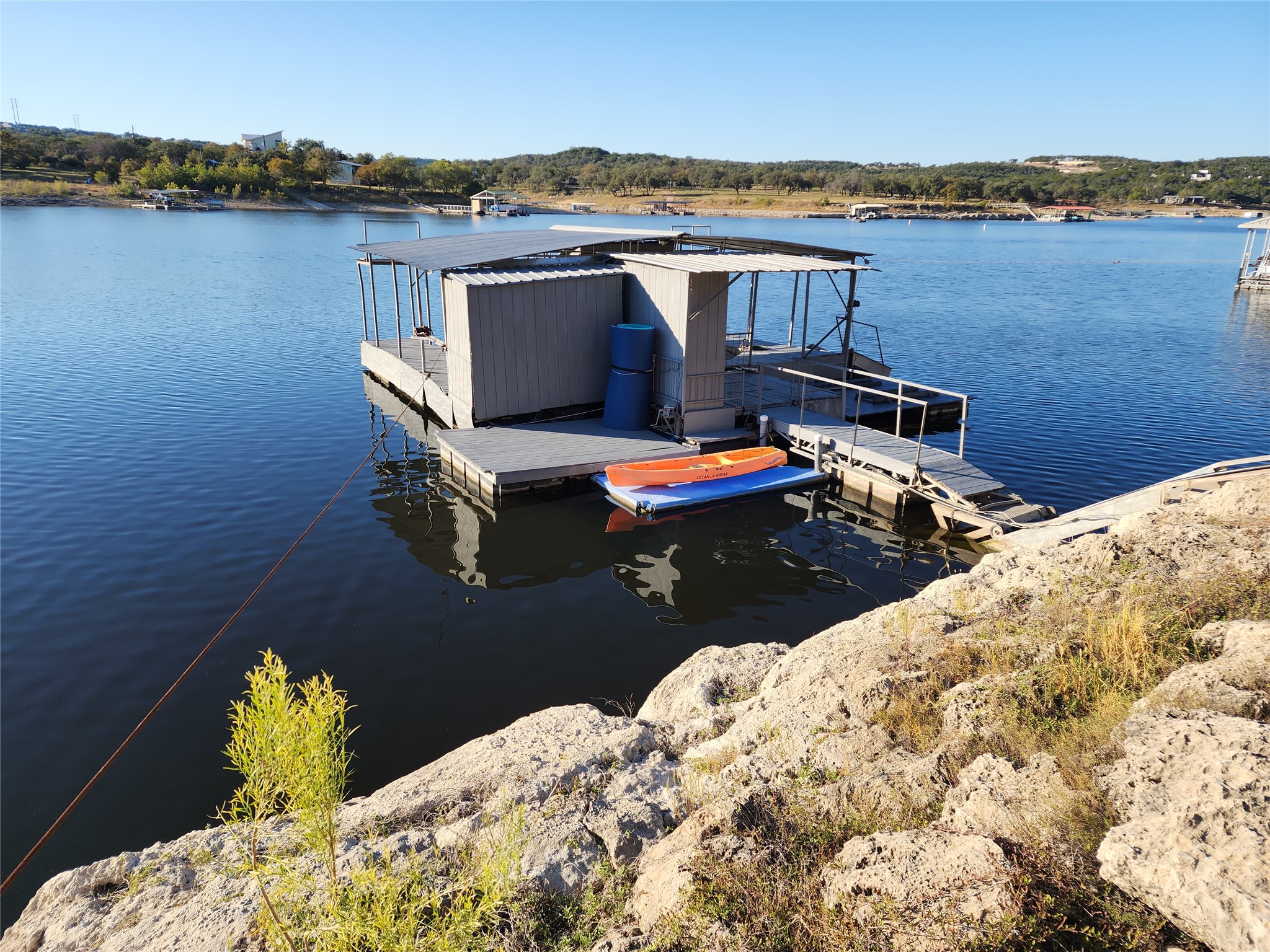 19645 Lakehurst Loop Spicewood, TX 78669 - Photo 9 of 40 Dock area featuring boat lift
