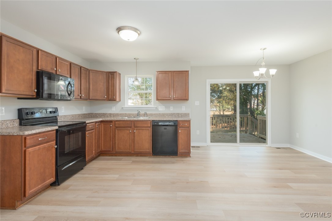 6336 Barrister Road Chesterfield, VA 23832 - Photo 10 of 39 a kitchen with stainless steel appliances granite countertop a stove sink and cabinets