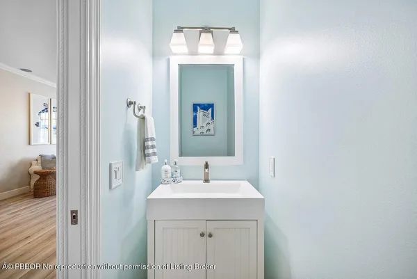 a kitchen with stainless steel appliances granite countertop a stove a sink a microwave a dining table and chairs