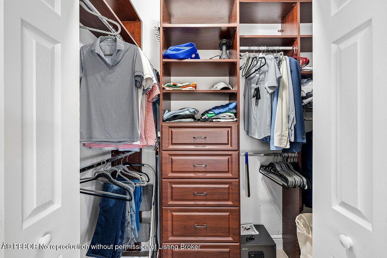 124 Harbors Way, Unit 124 Boynton Beach, FL 33435 - Photo 25 of 35 a view of walk in closet with clothes and shoes