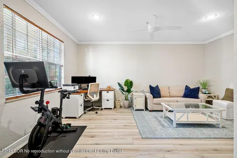 a kitchen with stainless steel appliances granite countertop a stove a sink a microwave a dining table and chairs