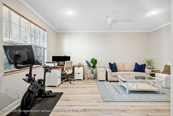 a living room with furniture window and a flat screen tv