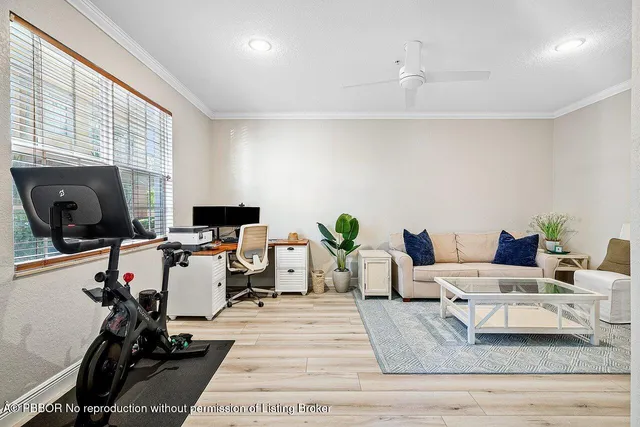 a kitchen with stainless steel appliances granite countertop a stove a sink a microwave a dining table and chairs