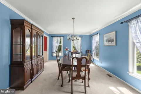 a view of a room with lounge chair windows and windows