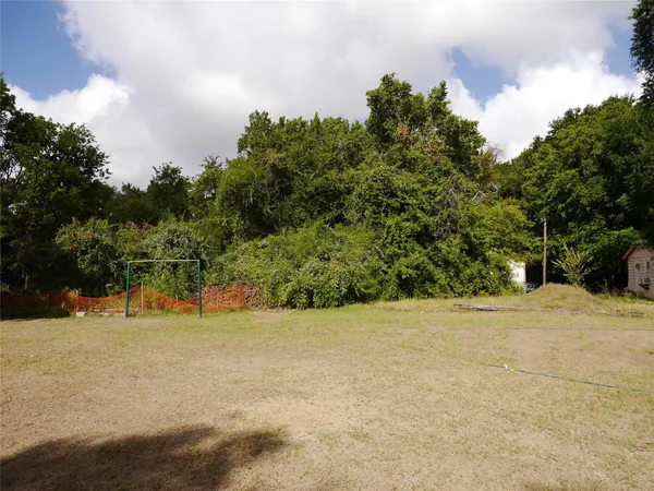 a view of a backyard of a house
