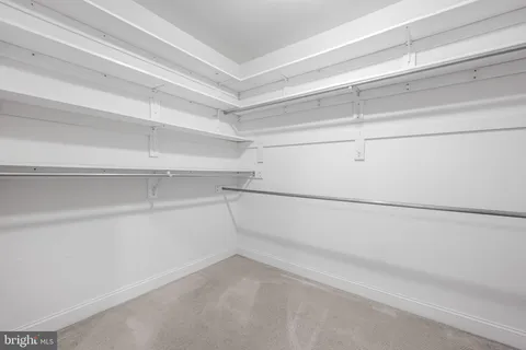 a view of an empty walk in closet