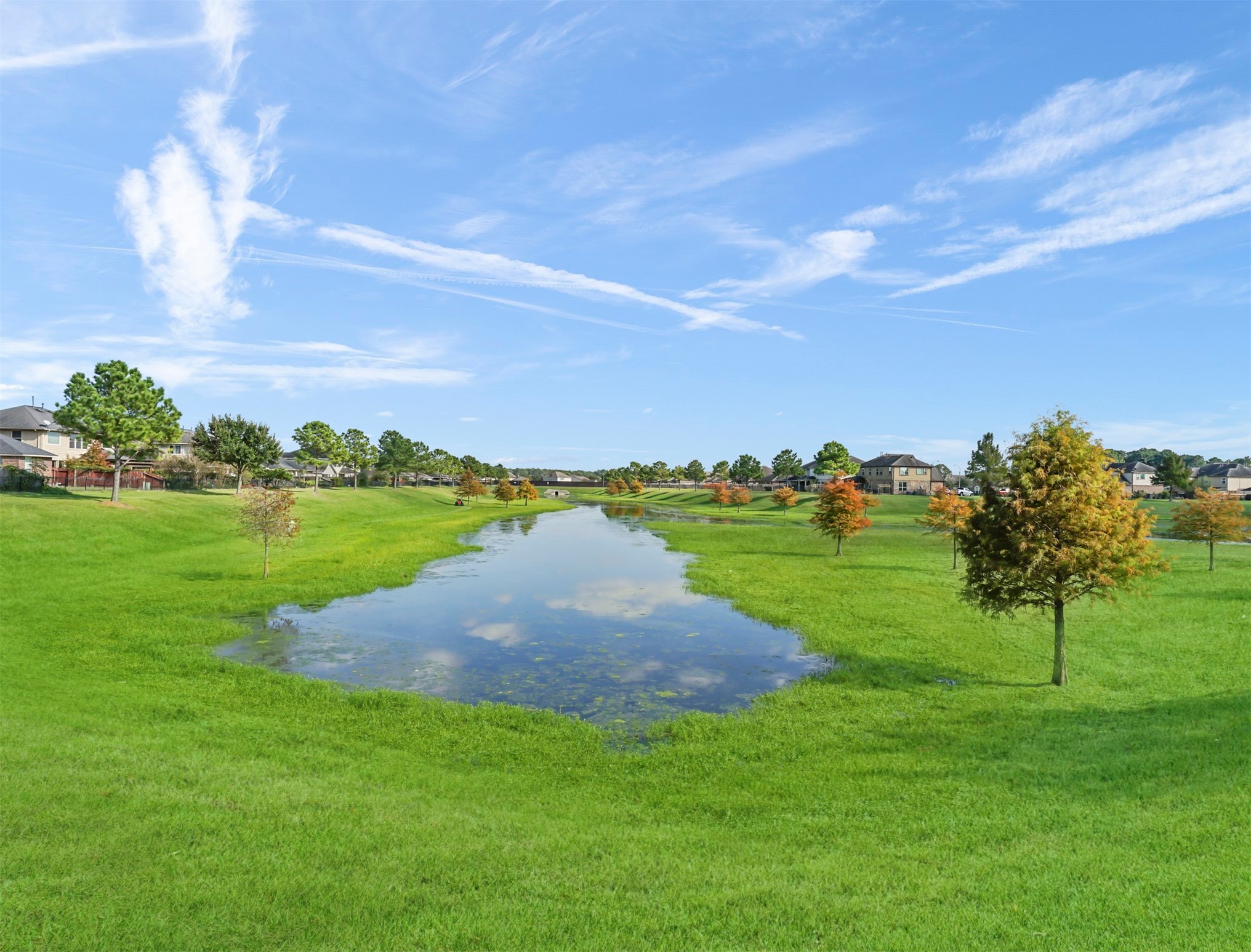 8214 Garrison Point Drive Houston, TX 77040 - Photo 36 of 37 a view of a golf course with a lake