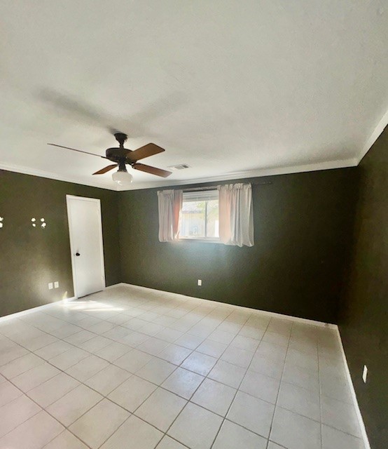2023 Westlake Road Houston, TX 77062 - Photo 13 of 18 a view of a big room with a ceiling fan and window