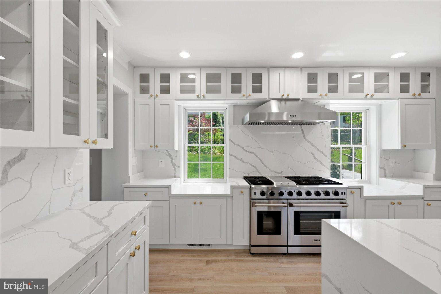 3517 Rodman Street Northwest Washington, DC 20008 - Photo 11 of 57 a kitchen with a stove top oven and cabinets