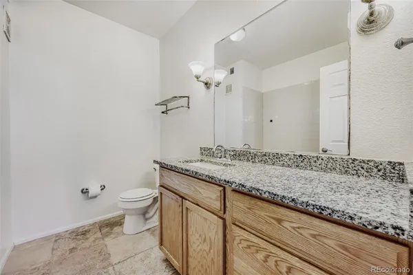 a bathroom with a bath tub with a shower