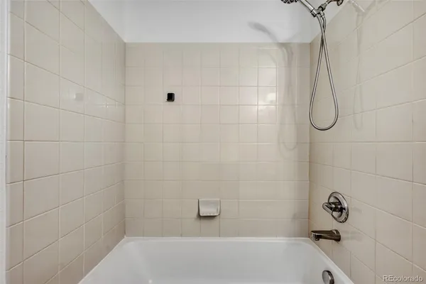 a close view of a utility room with dryer and washer