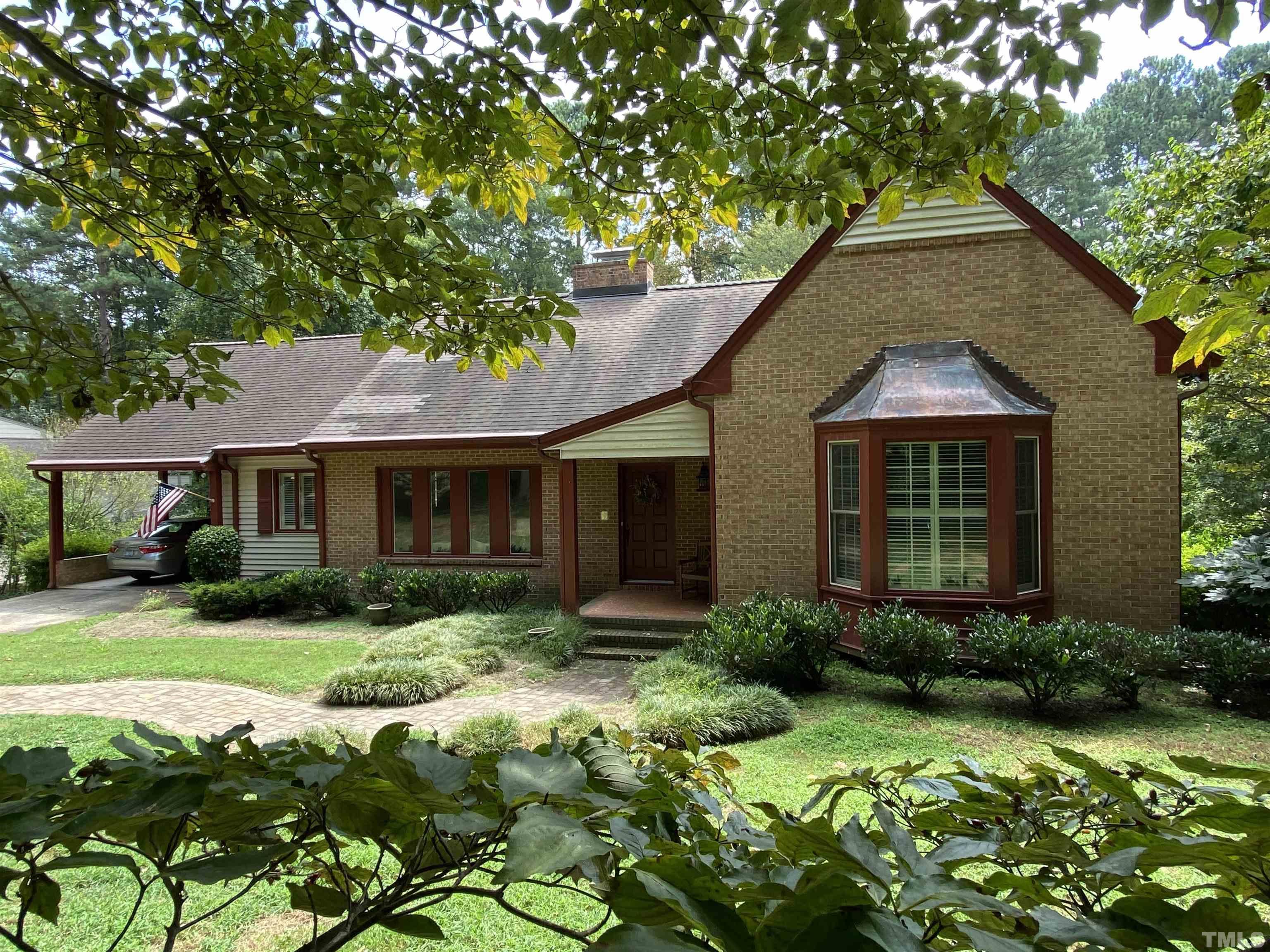 9005 Oneal Road Raleigh, NC 27613 - Photo 1 of 24 a front view of a house with a yard and porch