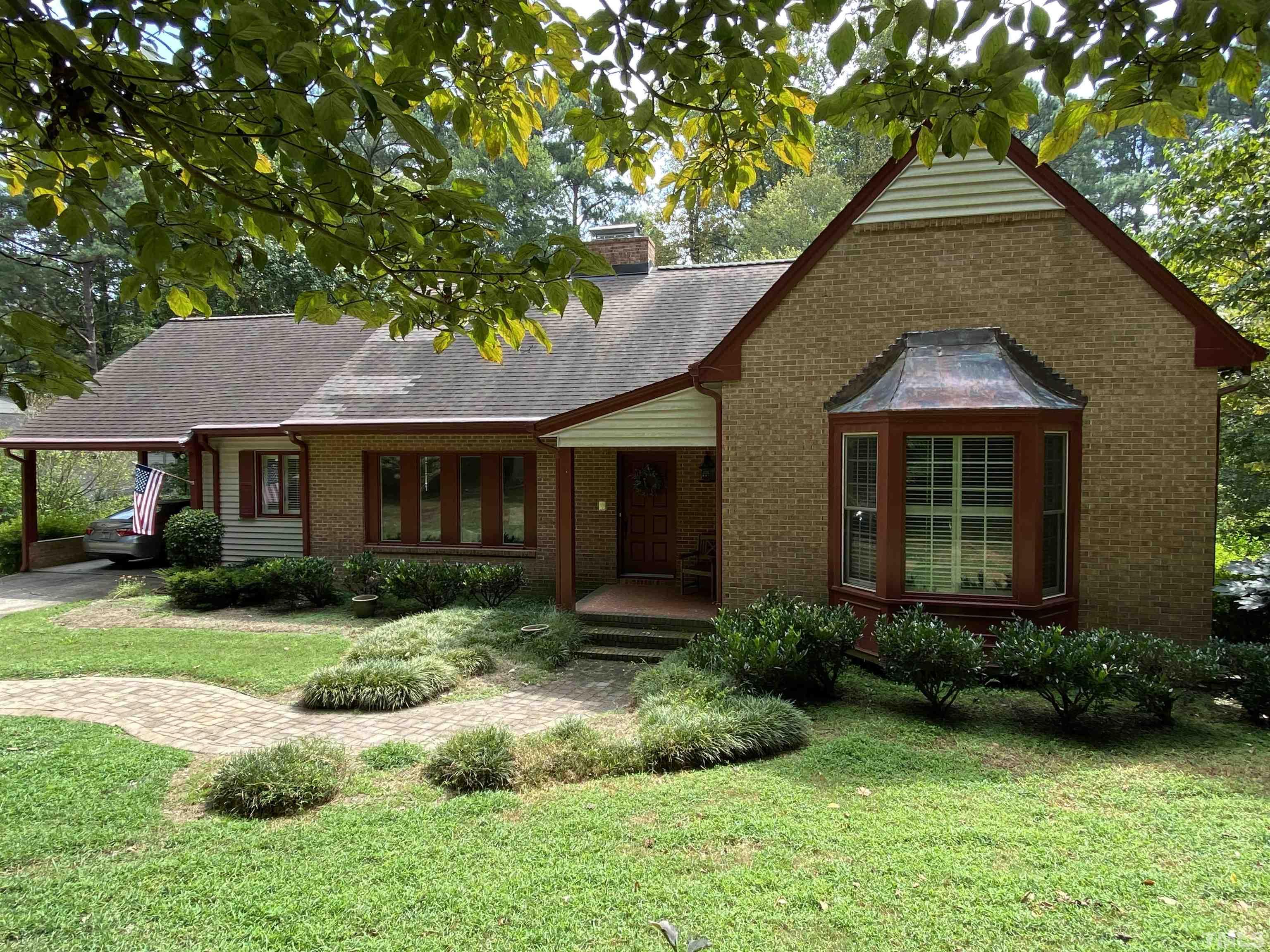 9005 Oneal Road Raleigh, NC 27613 - Photo 2 of 24 a front view of a house with garden