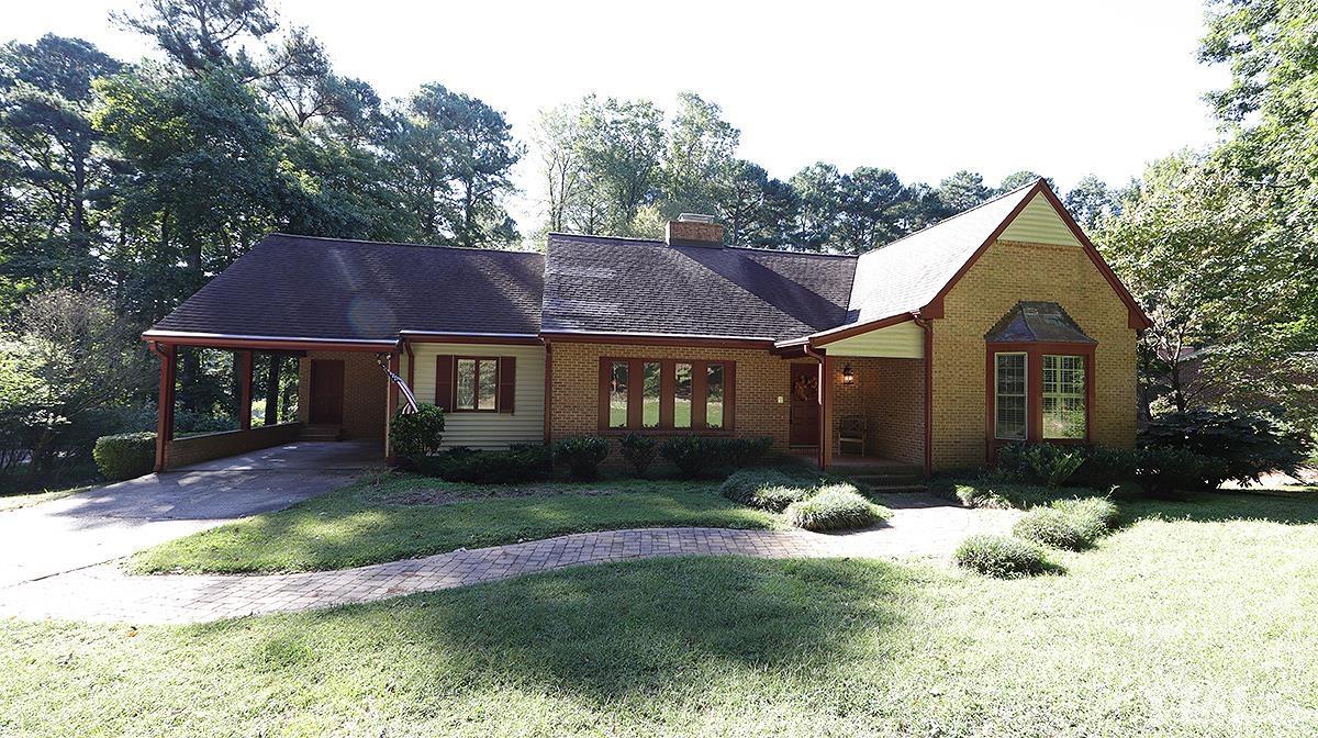 9005 Oneal Road Raleigh, NC 27613 - Photo 13 of 24 a front view of a house with a yard and garage