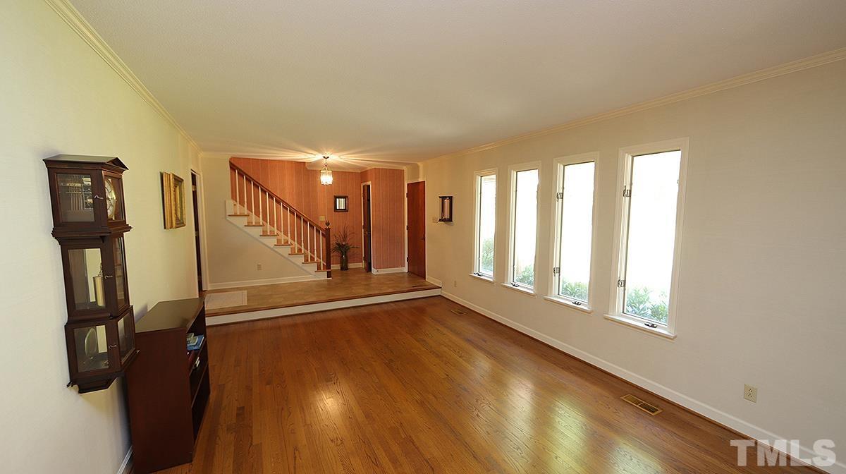 9005 Oneal Road Raleigh, NC 27613 - Photo 14 of 24 a view of an empty room with wooden floor and a window