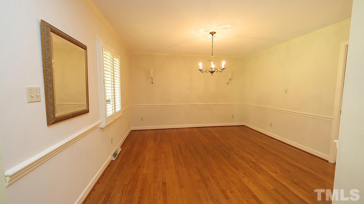 9005 Oneal Road Raleigh, NC 27613 - Photo 15 of 24 wooden floor in an empty room with a window