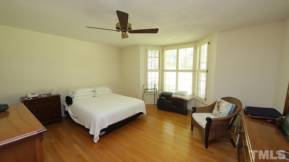 9005 Oneal Road Raleigh, NC 27613 - Photo 18 of 24 a bedroom with a bed and couch