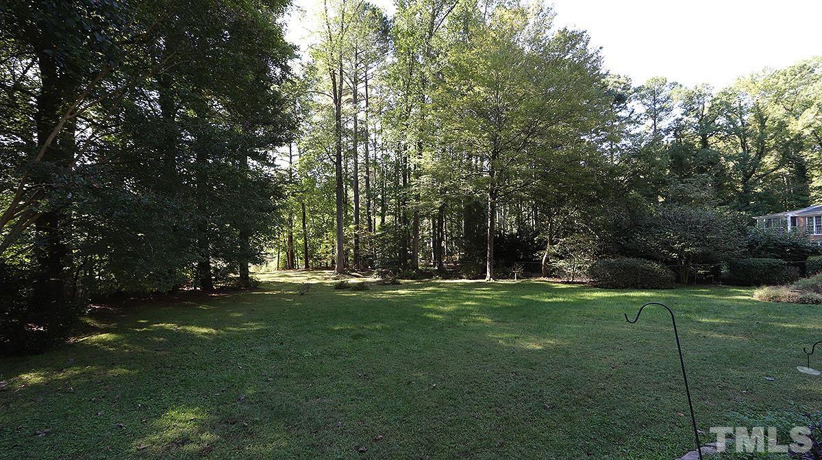 9005 Oneal Road Raleigh, NC 27613 - Photo 22 of 24 a big yard with trees