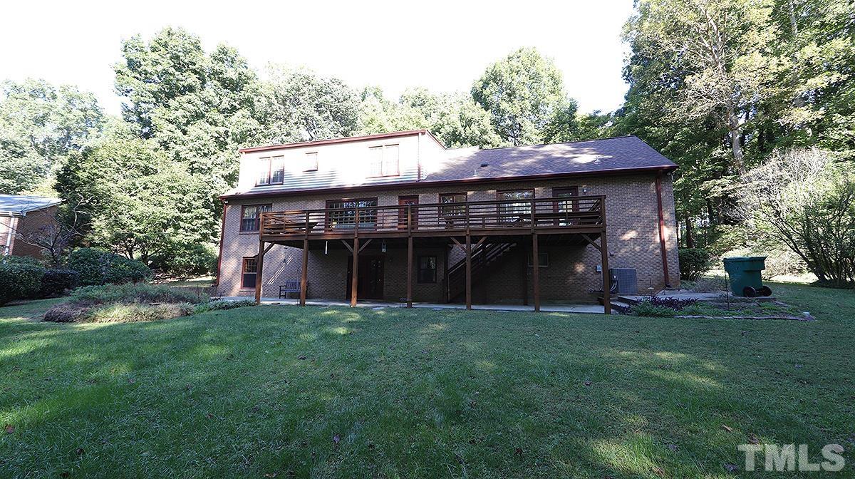 9005 Oneal Road Raleigh, NC 27613 - Photo 23 of 24 a view of a house with a yard and a large tree