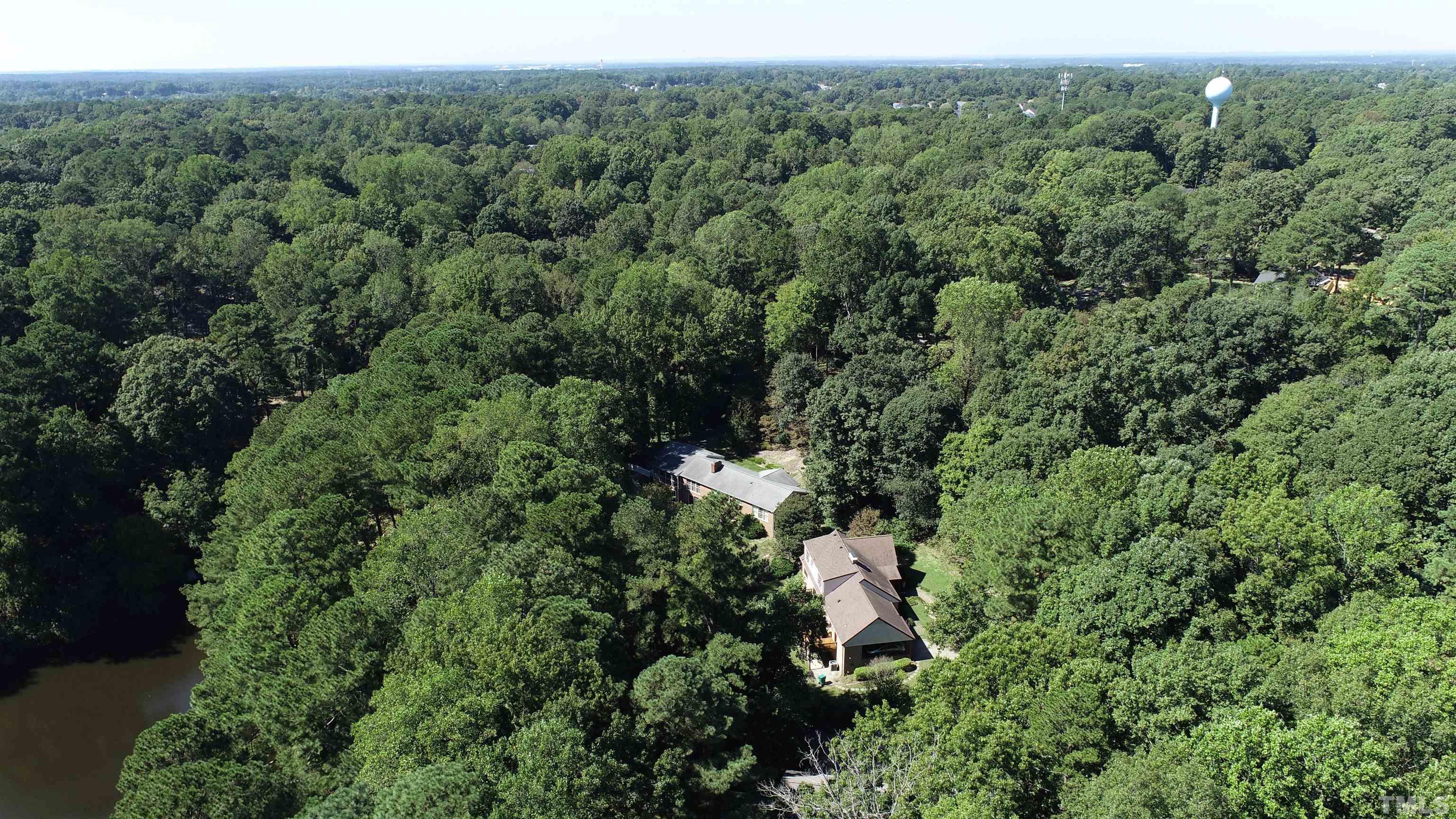 9005 Oneal Road Raleigh, NC 27613 - Photo 9 of 24 an aerial view of residential house with outdoor space and trees all around