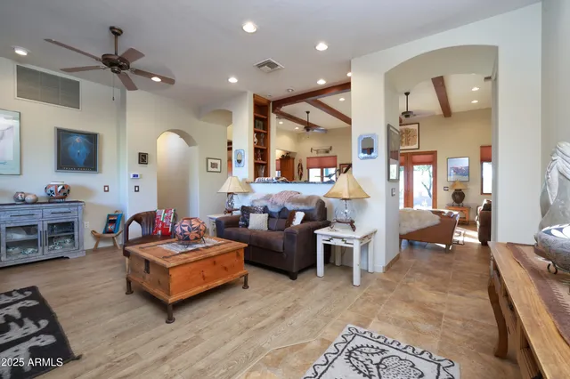 a living room with furniture fireplace and a flat screen tv