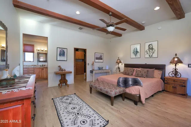 a living room with a bed furniture and a window