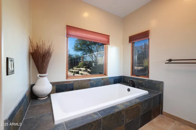 a bath tub sitting next to a window