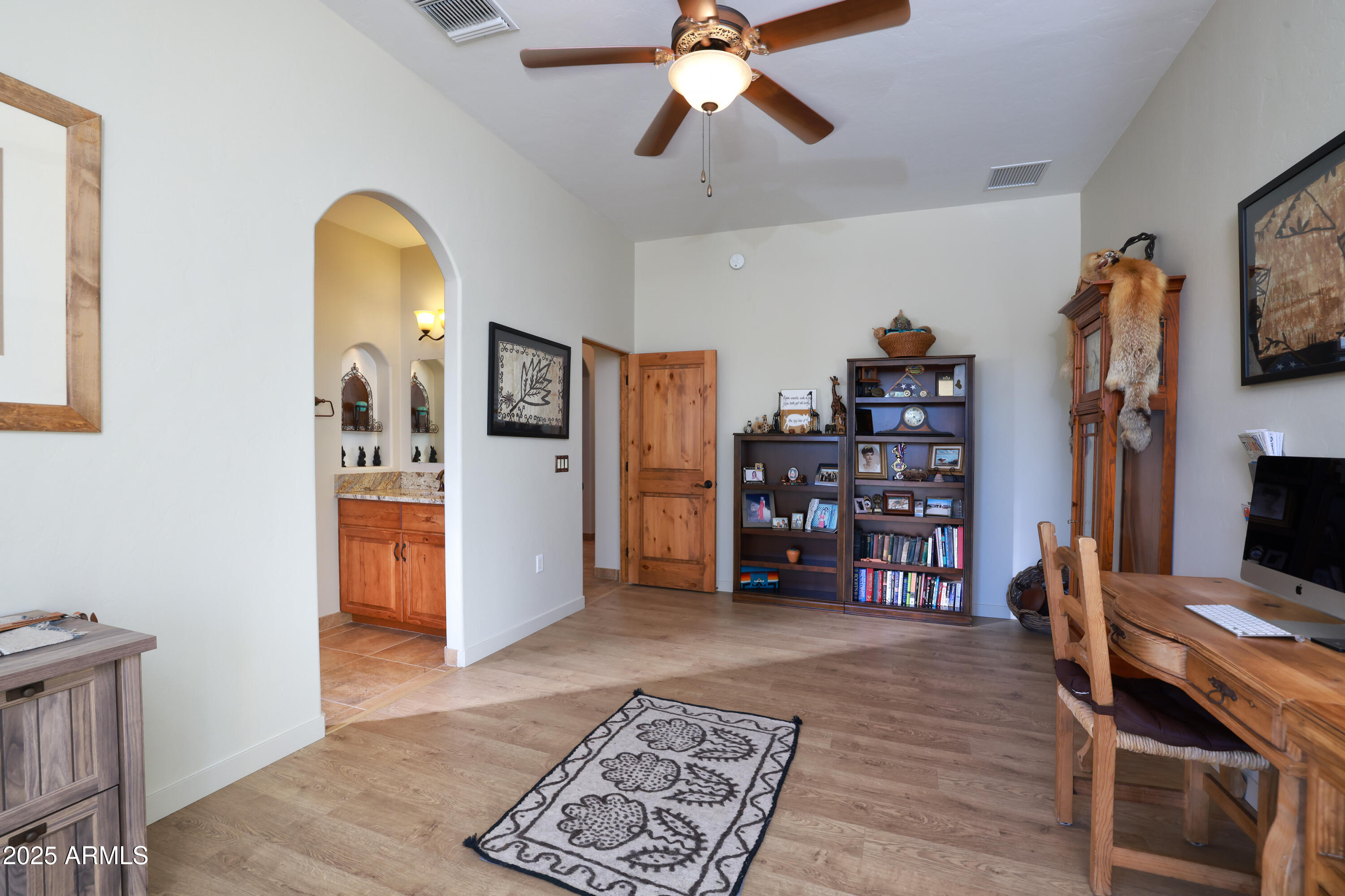 12800 West Arivaca Road Amado, AZ 85645 - Photo 27 of 48 a living room with furniture and a flat screen tv