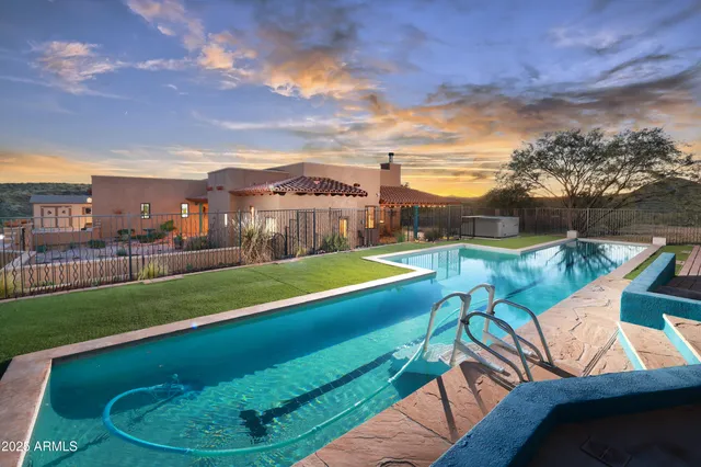 a view of a swimming pool with a seating space