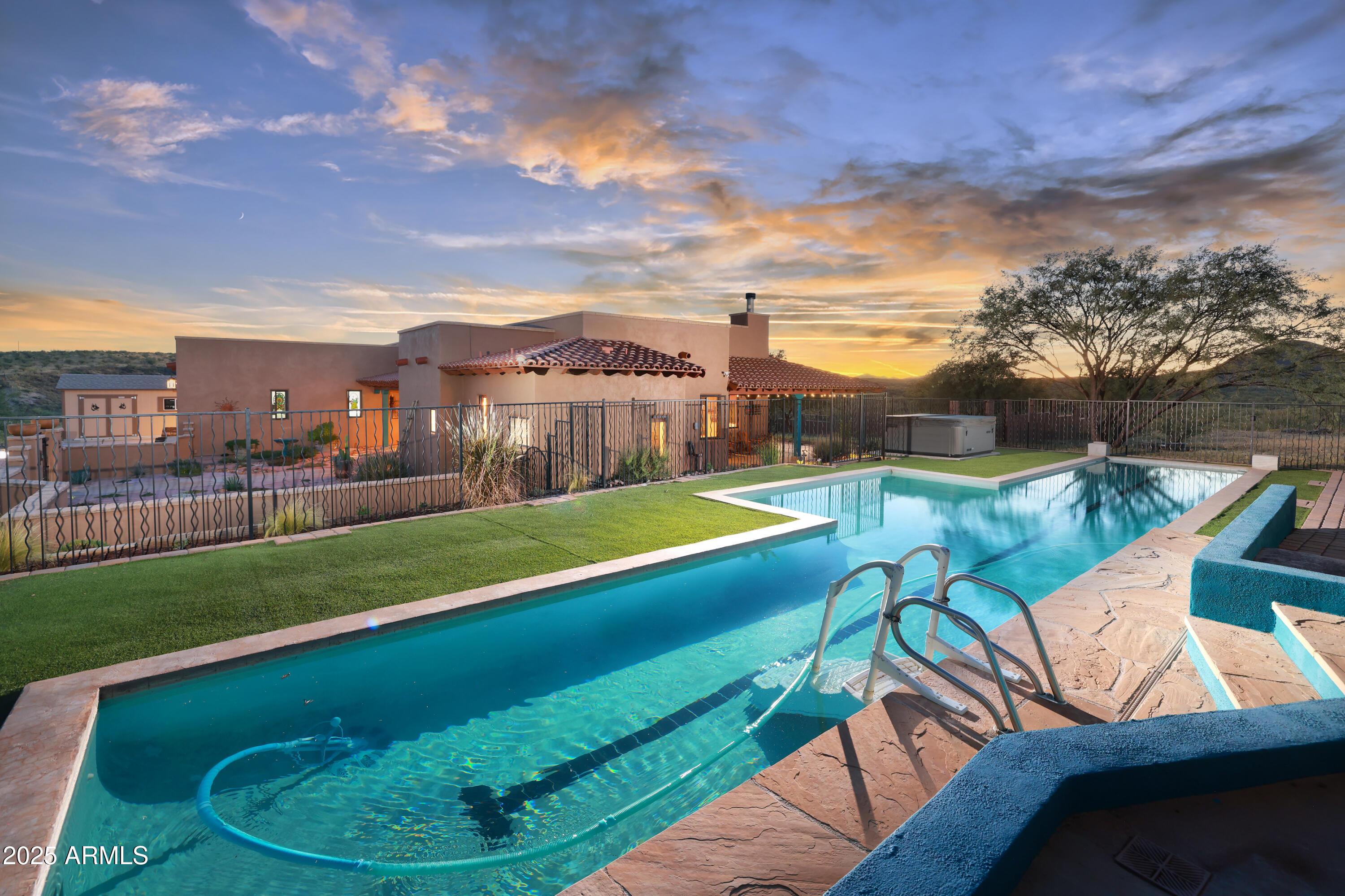 12800 West Arivaca Road Amado, AZ 85645 - Photo 3 of 48 a view of a swimming pool with a seating space