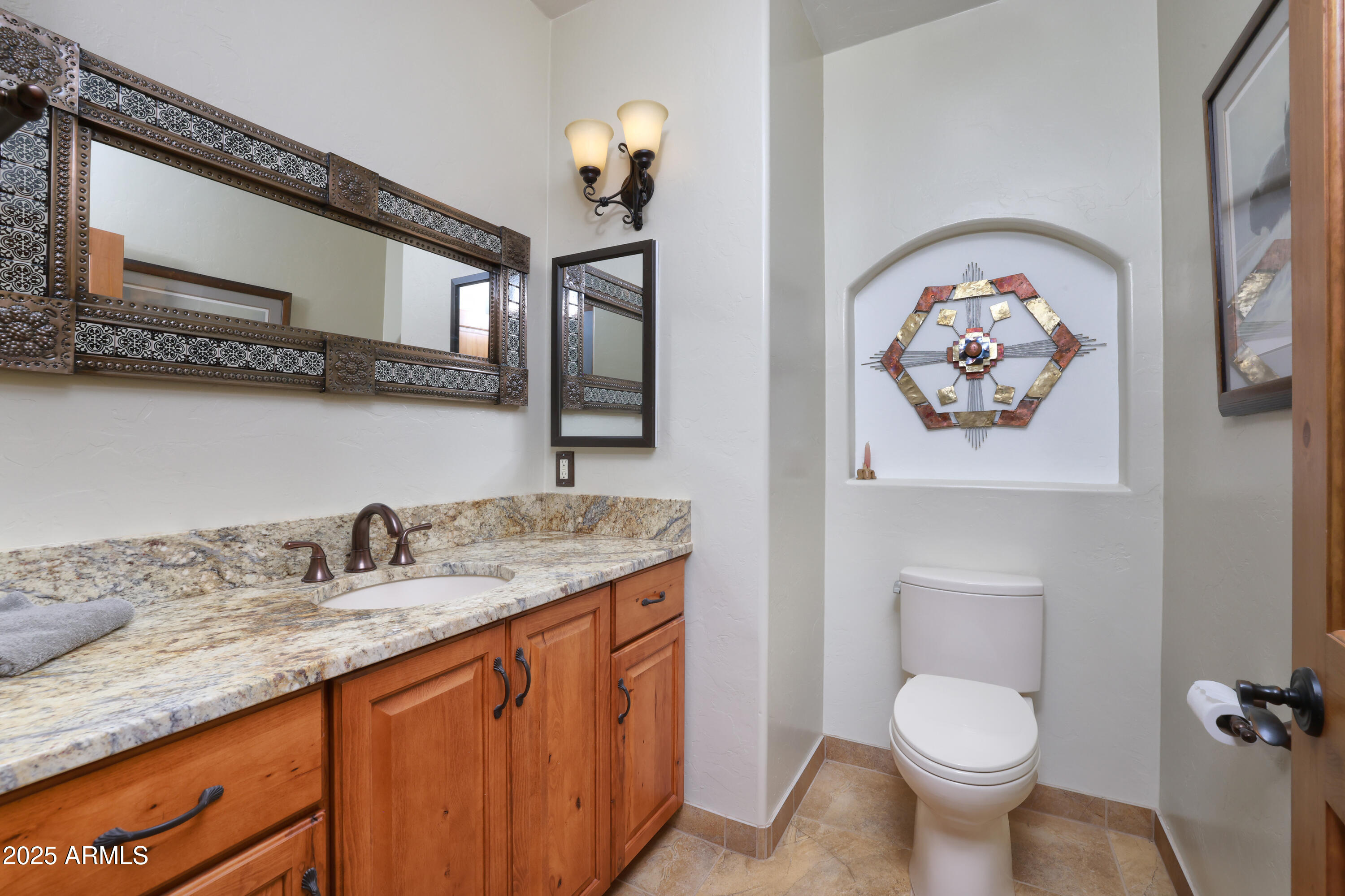 12800 West Arivaca Road Amado, AZ 85645 - Photo 33 of 48 a bathroom with a granite countertop sink and a mirror