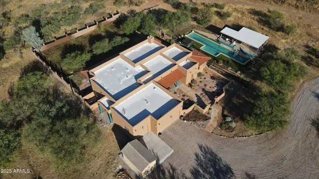 an aerial view of a house with outdoor space