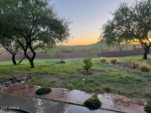 a building outdoor space with patio furniture and potted plants