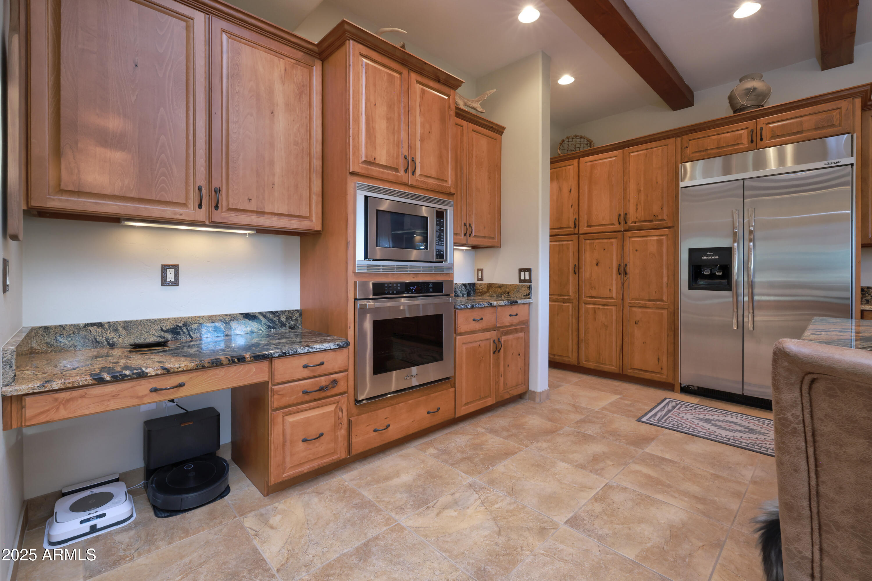 12800 West Arivaca Road Amado, AZ 85645 - Photo 10 of 48 a kitchen with stainless steel appliances granite countertop a stove a refrigerator and a stove top oven