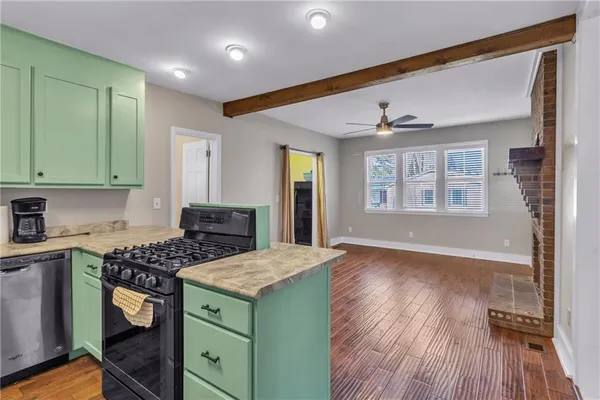 a kitchen with a wooden floor and window