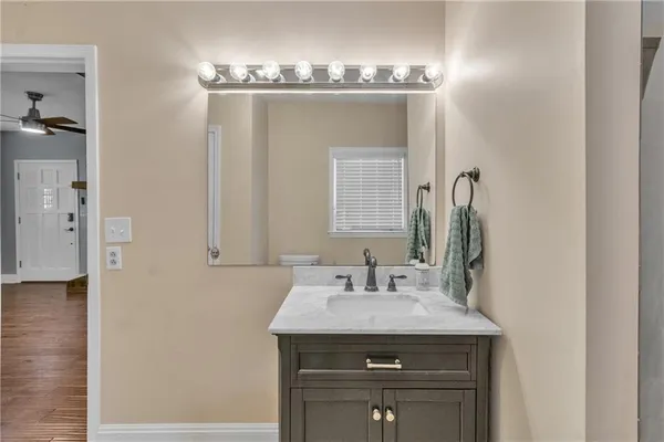a bathroom with a sink and a mirror