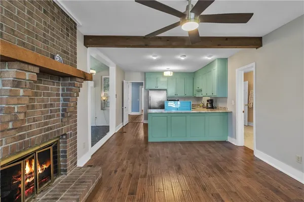 a kitchen with cabinets and a fireplace