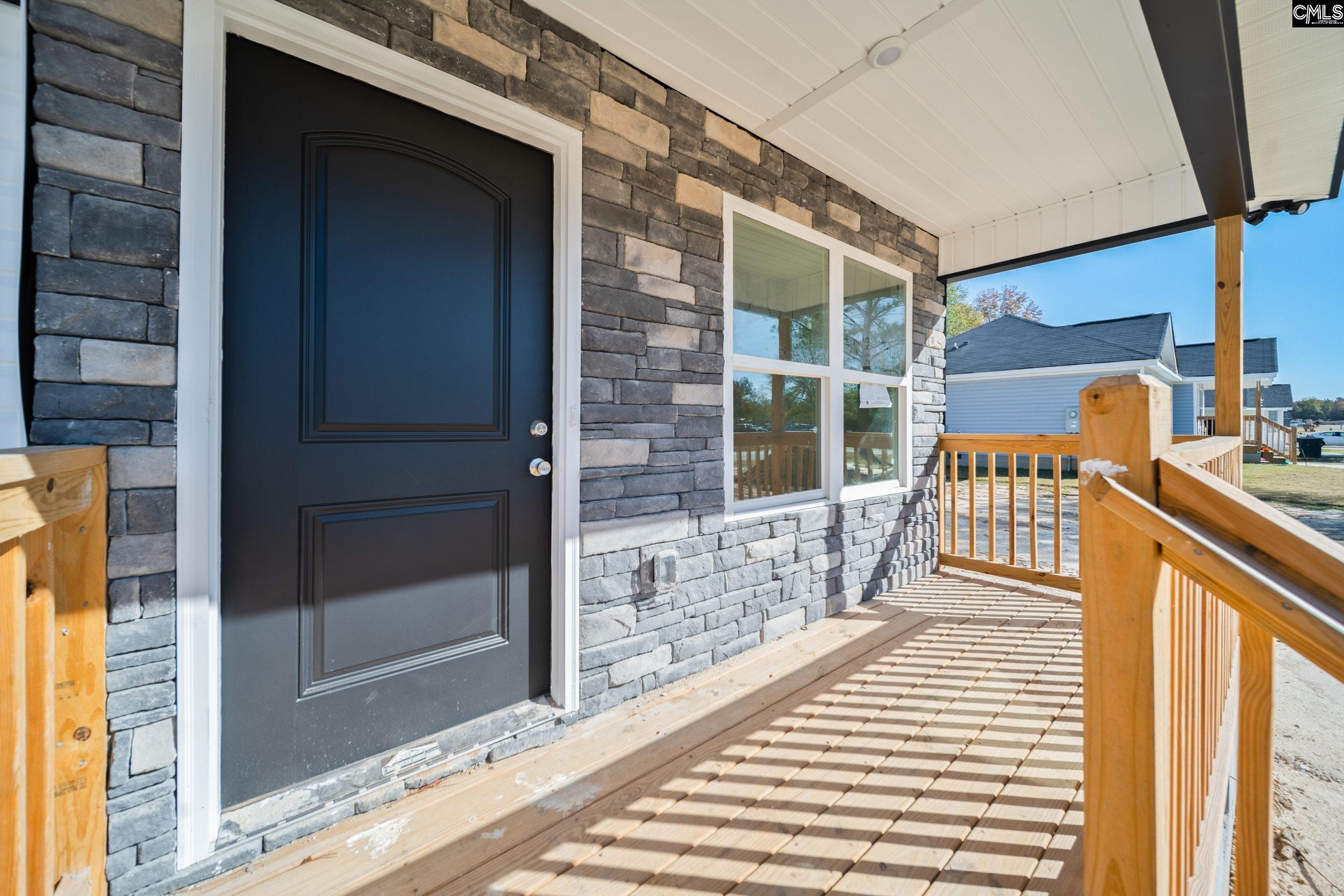 116 Sunny Acres Road Eastover, SC 29044 - Photo 2 of 40 a balcony with view of outdoor space