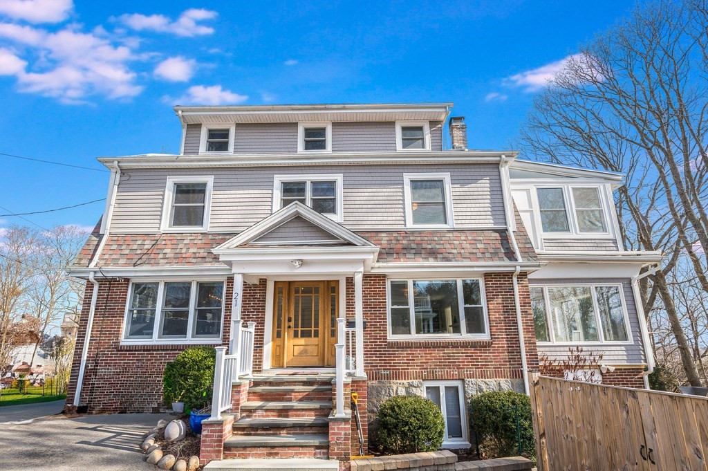 a front view of a house with a yard