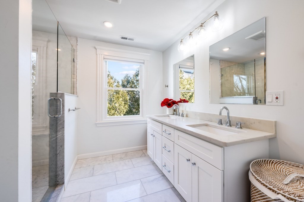21 Arborough Road Boston, MA 02131 - Photo 17 of 40 a bathroom with a granite countertop sink mirror and a bathtub