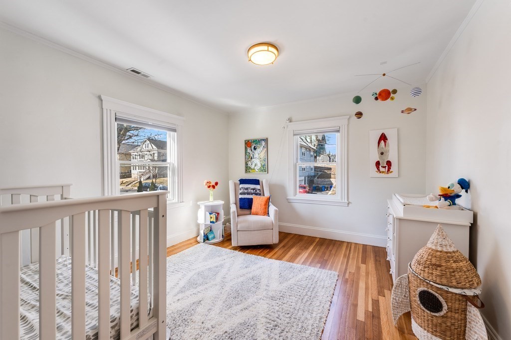 21 Arborough Road Boston, MA 02131 - Photo 19 of 40 a living room with furniture and a wooden floor