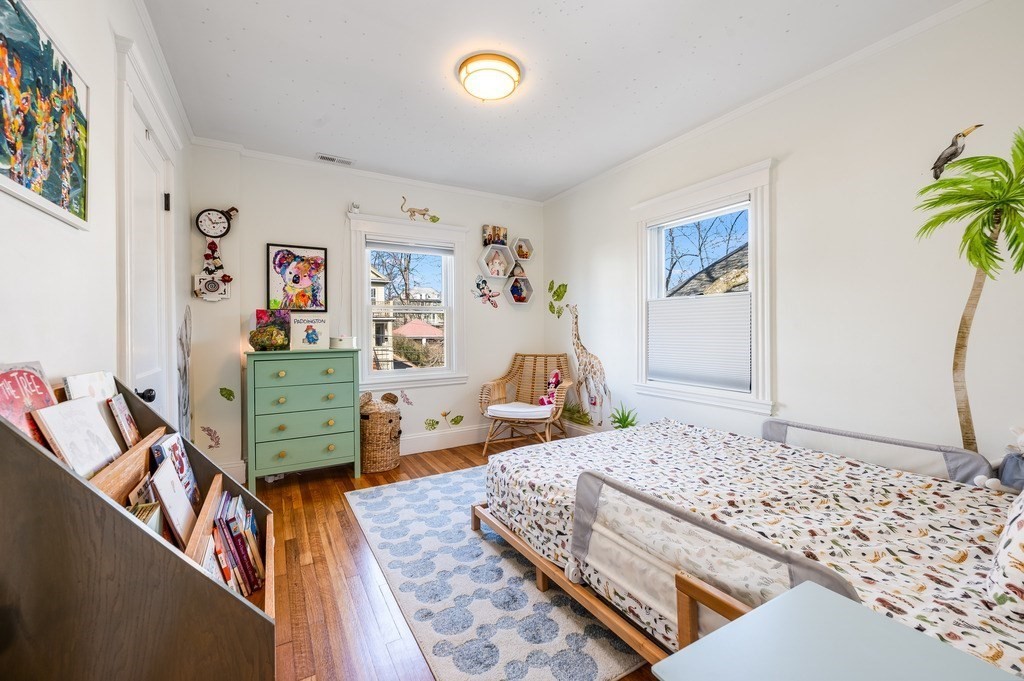 21 Arborough Road Boston, MA 02131 - Photo 20 of 40 a living room with furniture and a flat screen tv