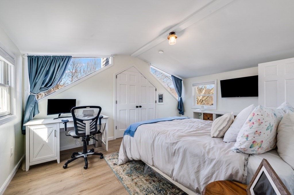 21 Arborough Road Boston, MA 02131 - Photo 23 of 40 a bed room with a bed tv and a chair