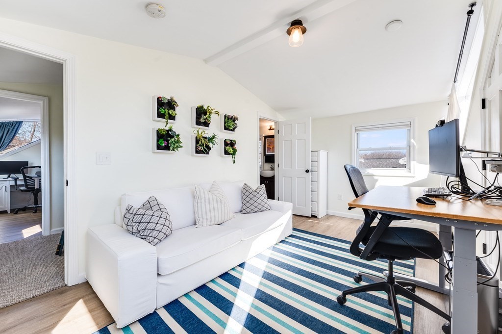 21 Arborough Road Boston, MA 02131 - Photo 26 of 40 a living room with furniture and wooden floor