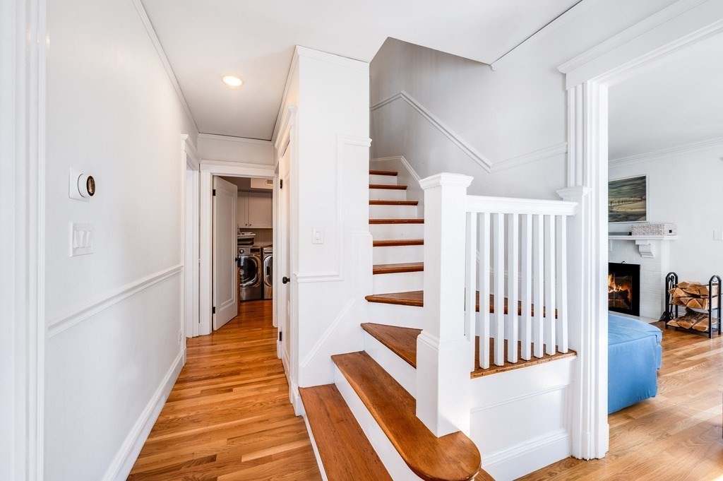 21 Arborough Road Boston, MA 02131 - Photo 27 of 40 a view of entryway with stairs and wooden floor