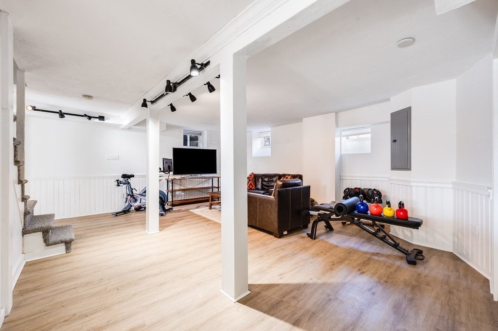 21 Arborough Road Boston, MA 02131 - Photo 28 of 40 a living room with furniture and a flat screen tv